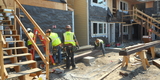 Construction workers remodeling affordable housing