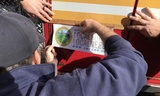 Crews affix a Measure K decal on a new fie engine to let residents know where their local tax dollars are going.